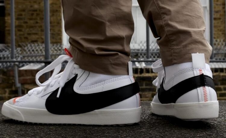 Close-up view of feet in Nike Blazers.